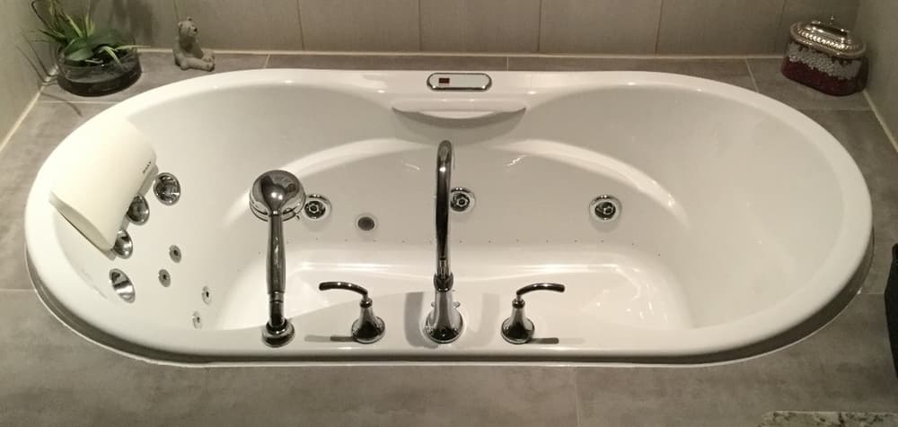 Bathroom renovation with new tub and tilework